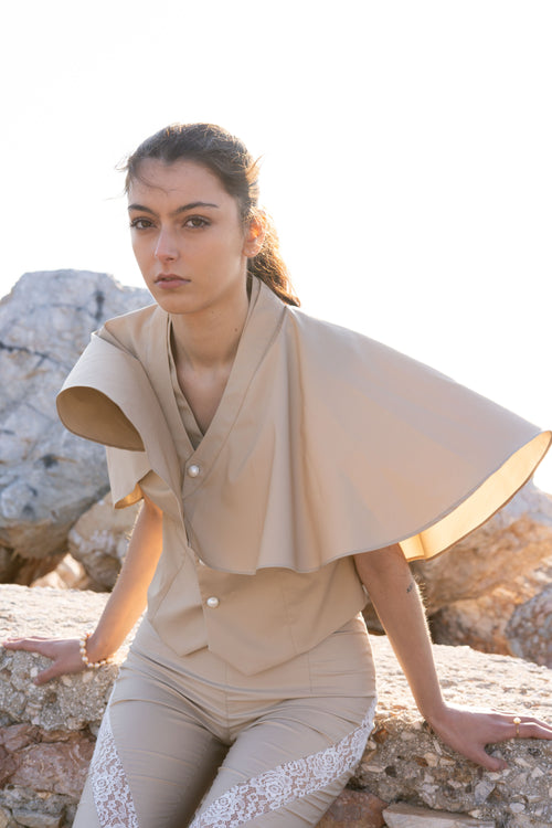 Bamboo Breeze detachable cape over vest in soft beige, sculptural layered design with fluid movement, elegant summer statement piece