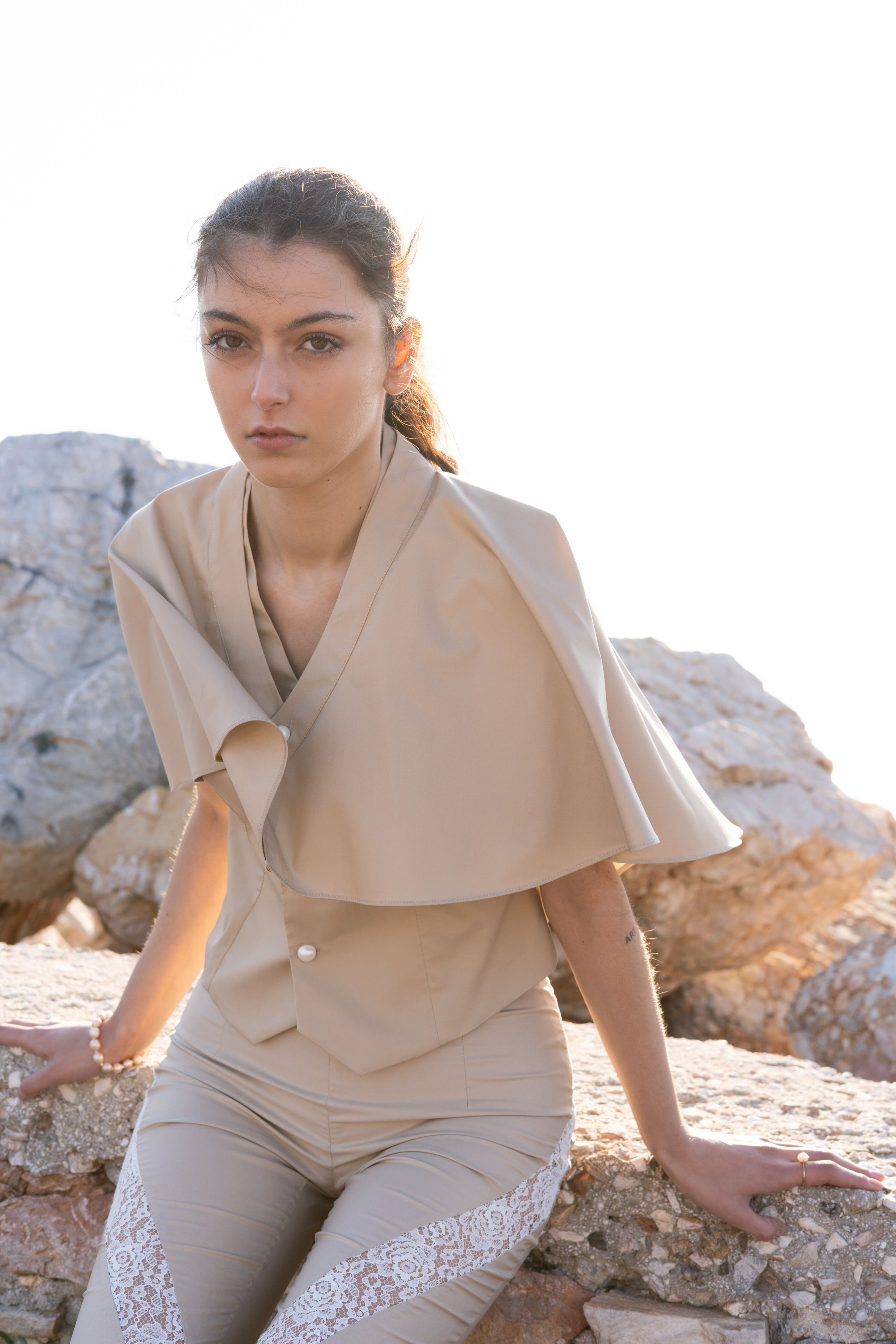 Bamboo Breeze vest and cape soft portrait, beige layered cape over tailored vest, relaxed elegant summer styling, warm natural light close-up