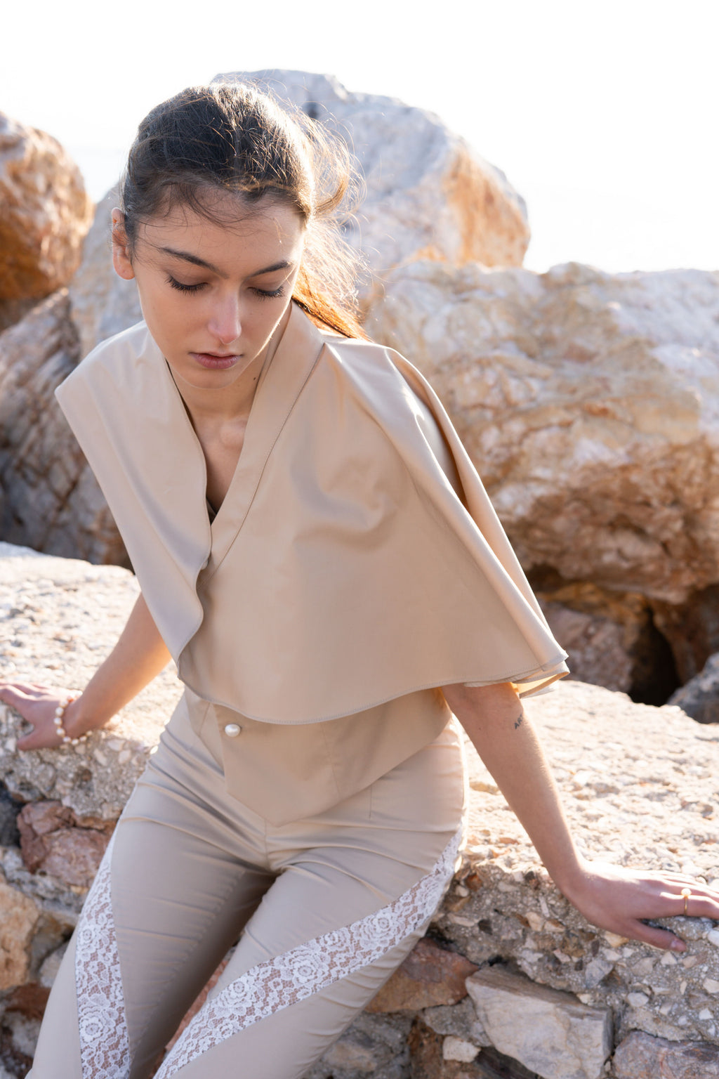 Julia Valas bamboo vest and detachable cape close up pearl buttons draped cape beige tailored set lace detail pants minimalist summer outfit