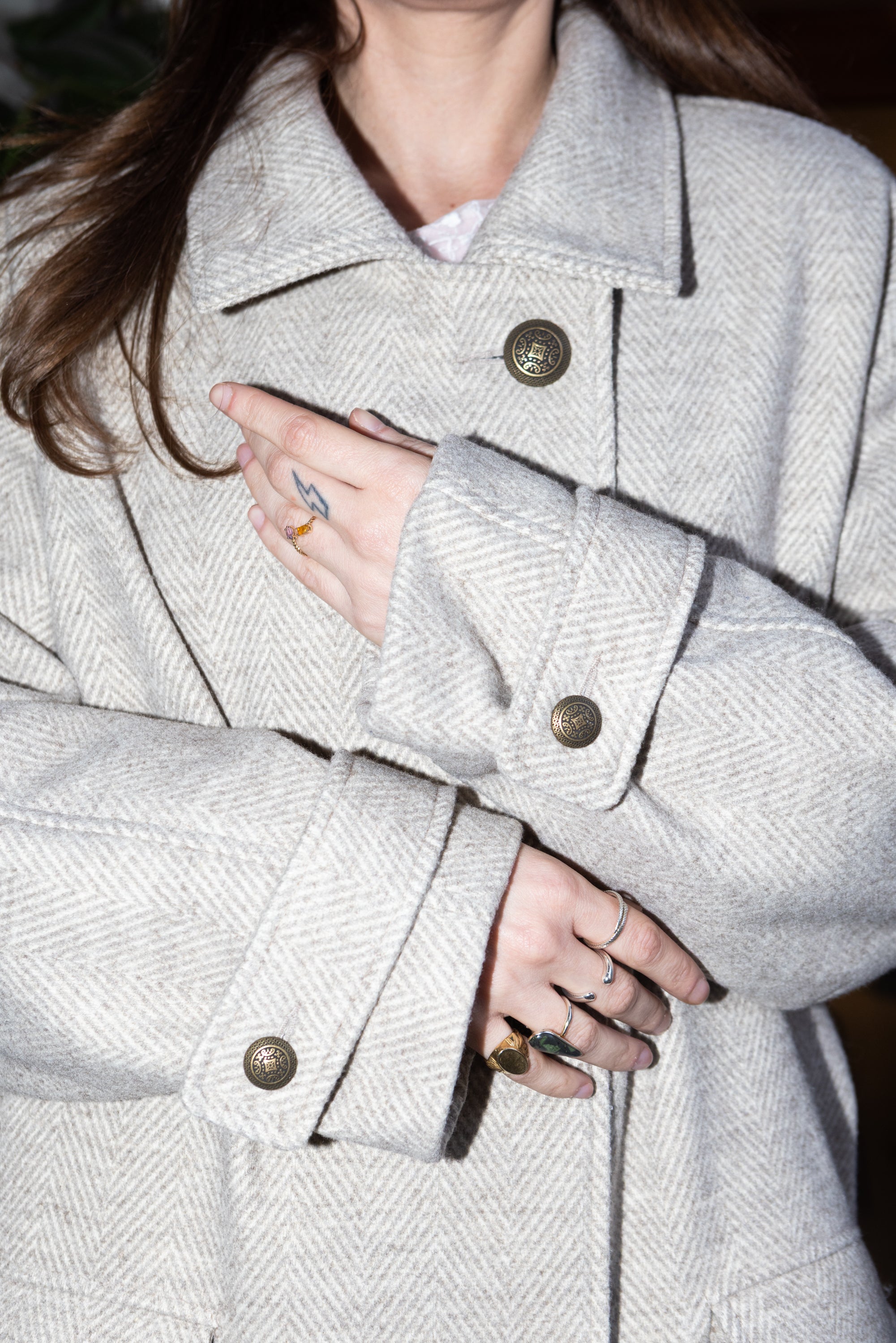 Convertible Collar Coat – detail view of wool herringbone fabric, collar and button closure, sleeve cuffs and styling, FW25-26 Julia Valas