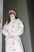 Convertible Collar Coat – high-neck closure styling, wool herringbone coat, front view with buttons, FW25-26 Julia Valas