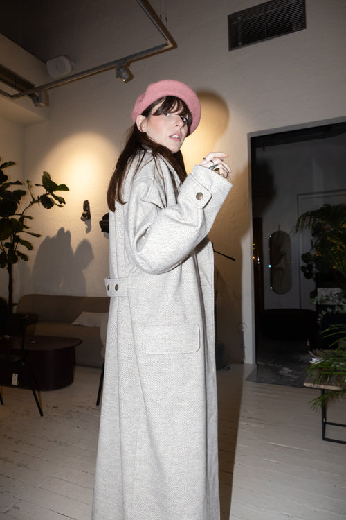 Convertible Collar Coat – oversized wool herringbone coat, side profile view, belted waist detail, pink beret styling, FW25-26 Julia Valas
