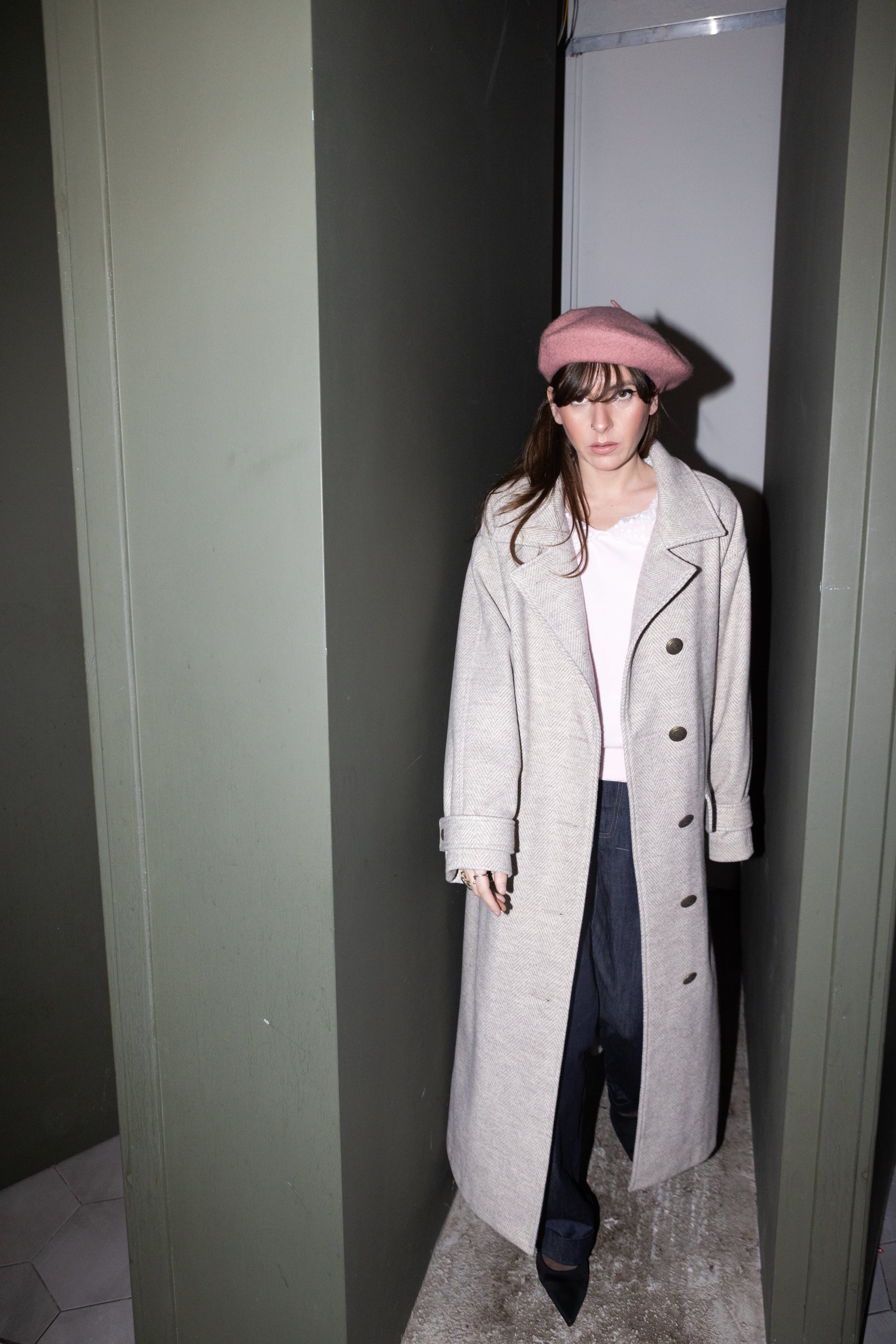 Convertible Collar Coat – oversized wool herringbone coat, full body front view, model standing in doorway, pink beret styling, FW25-26 Julia Valas