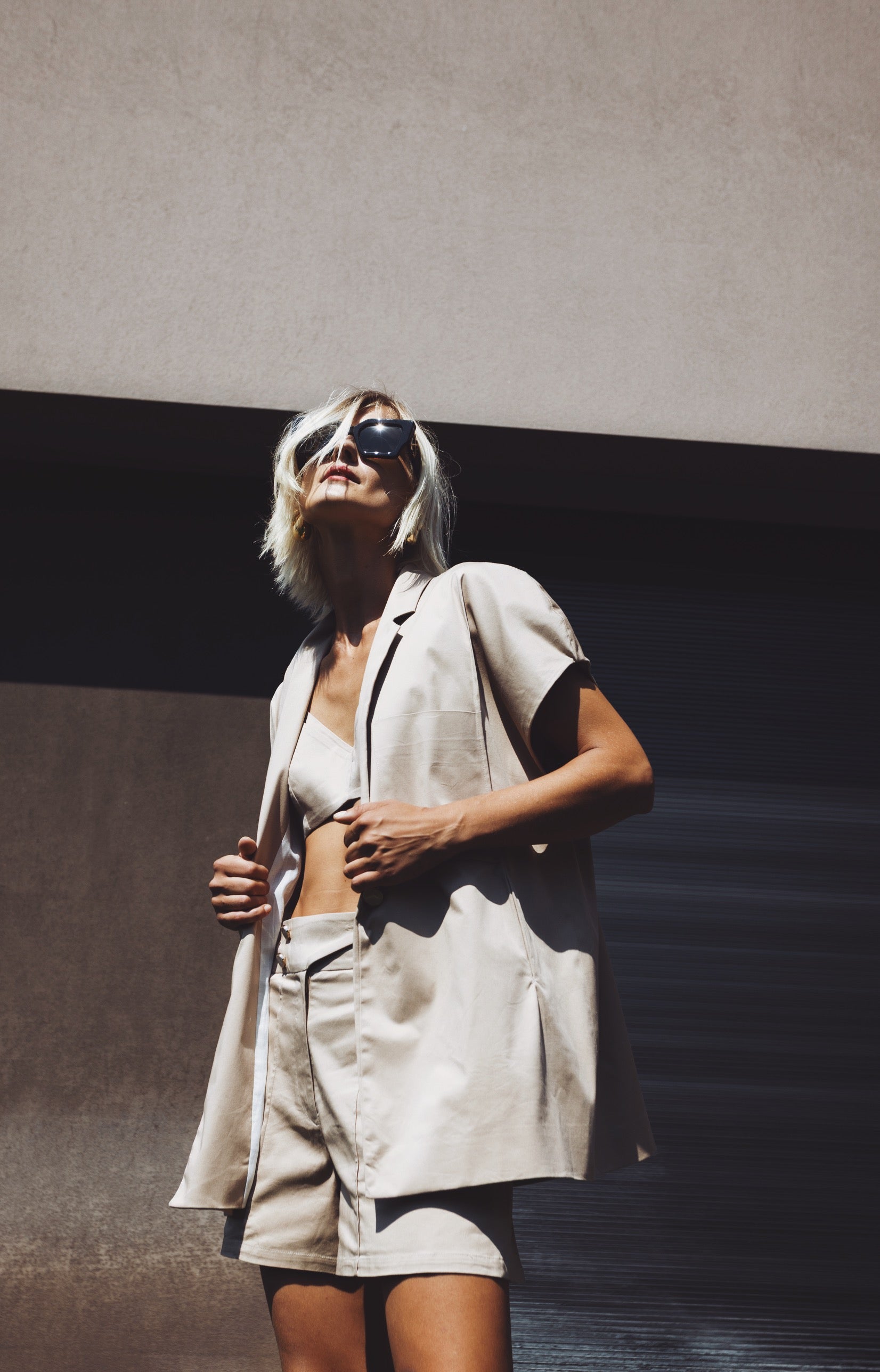 Oversized cotton Halo blazer worn open with short voluminous sleeves, styled look and paired with the Halo bermouda.
