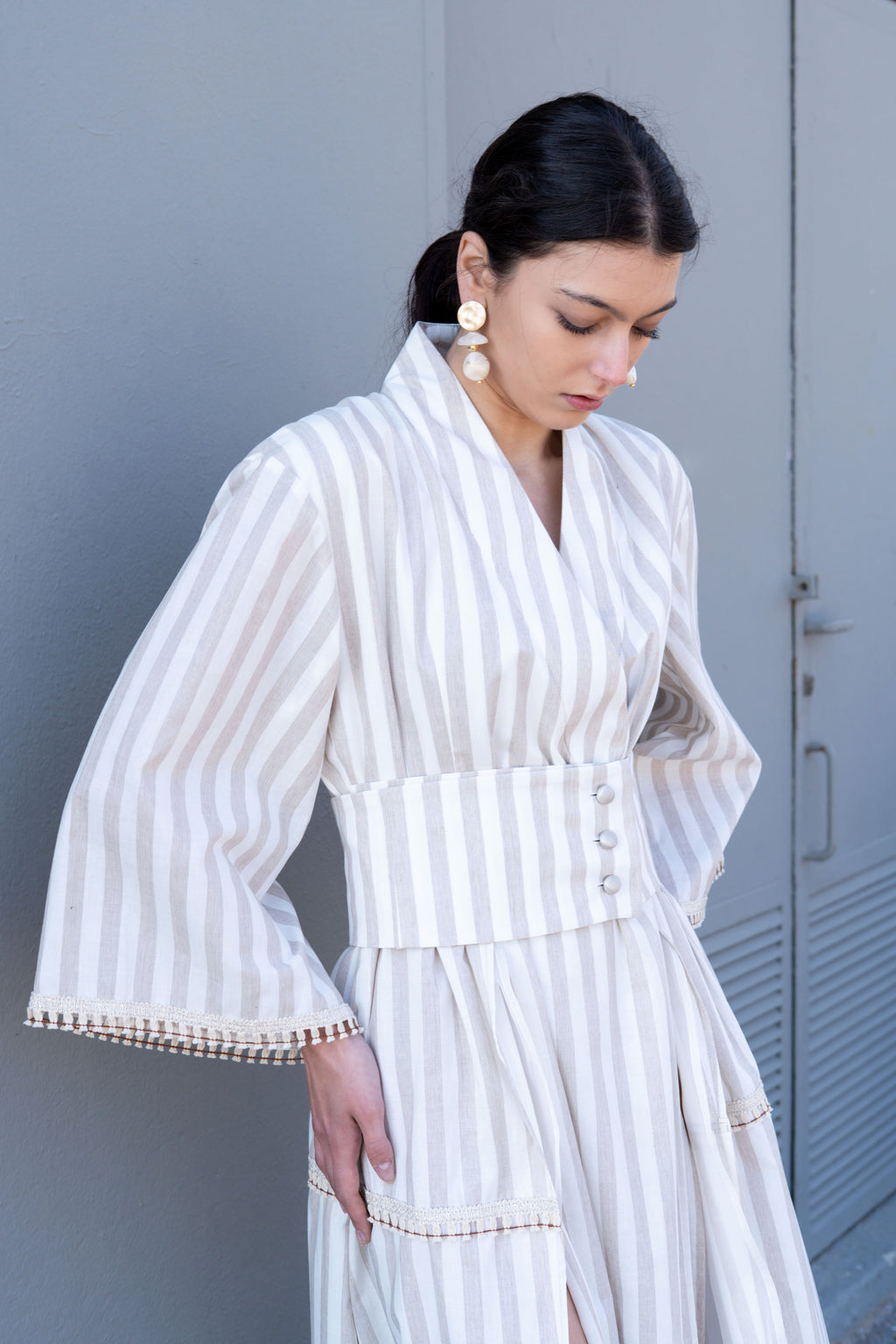 Striped cotton kimono dress waist detail with wide belt and button closure, soft structured fit and relaxed sleeve design
