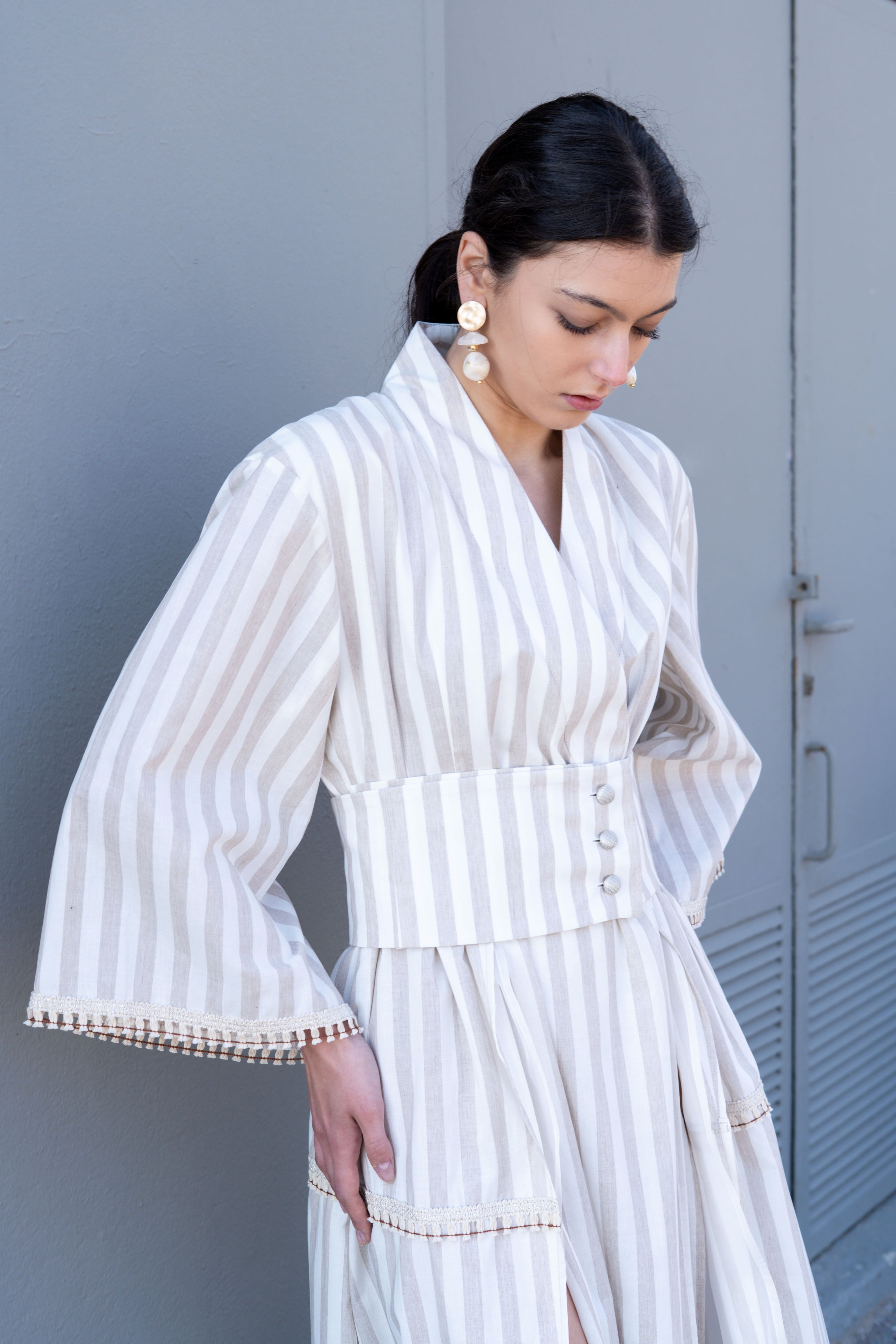 Striped cotton kimono dress waist detail with wide belt and button closure, soft structured fit and relaxed sleeve design