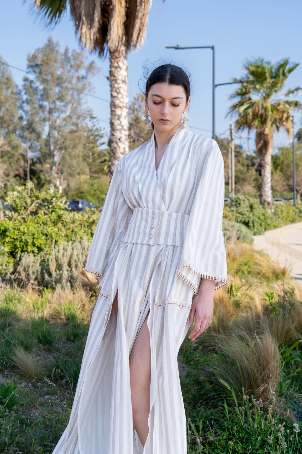 Striped cotton kimono dress front view with wide belt, deep slit and flowing skirt, lightweight summer silhouette