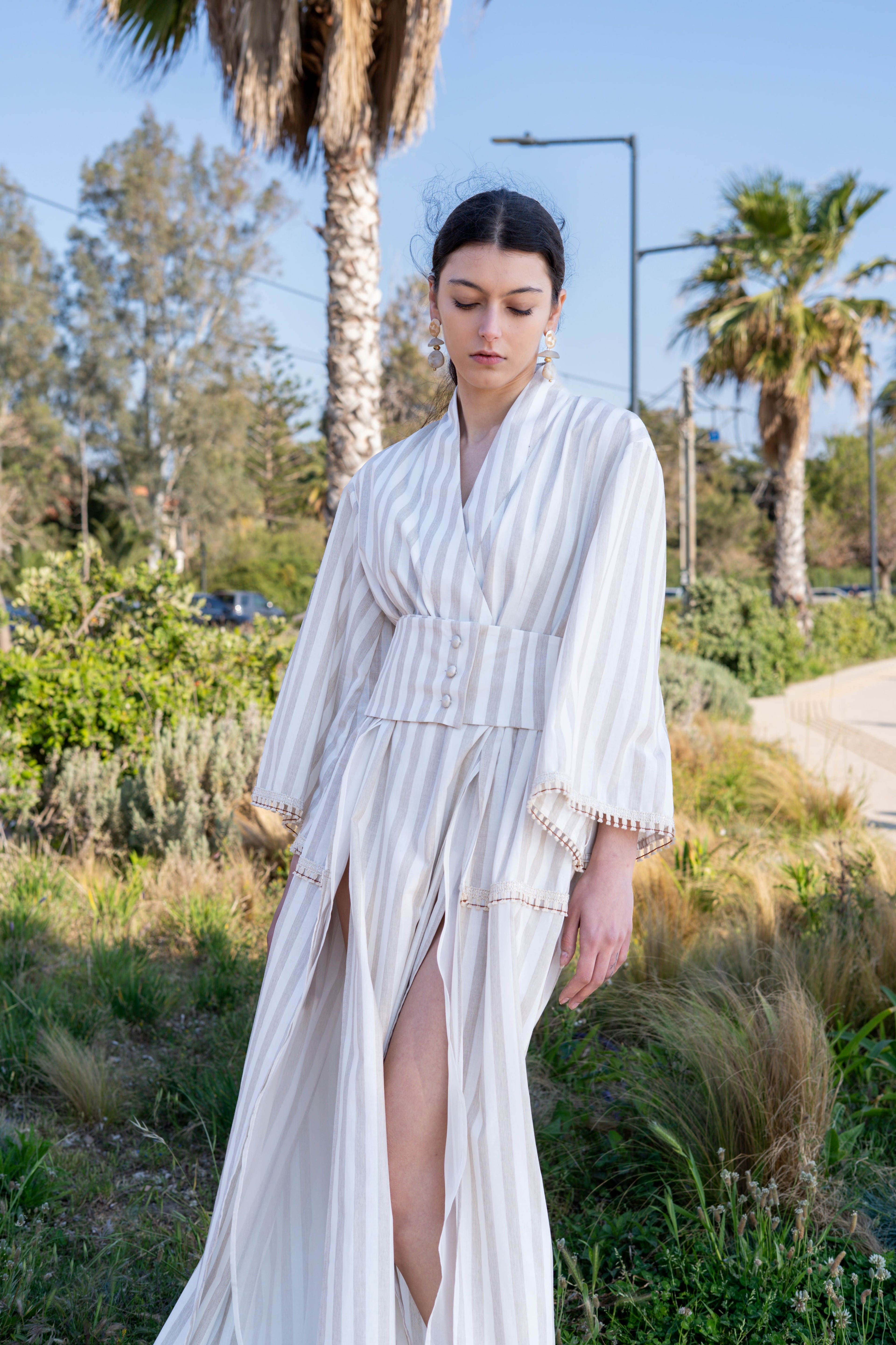 Striped cotton kimono dress front view with wide belt, deep slit and flowing skirt, lightweight summer silhouette