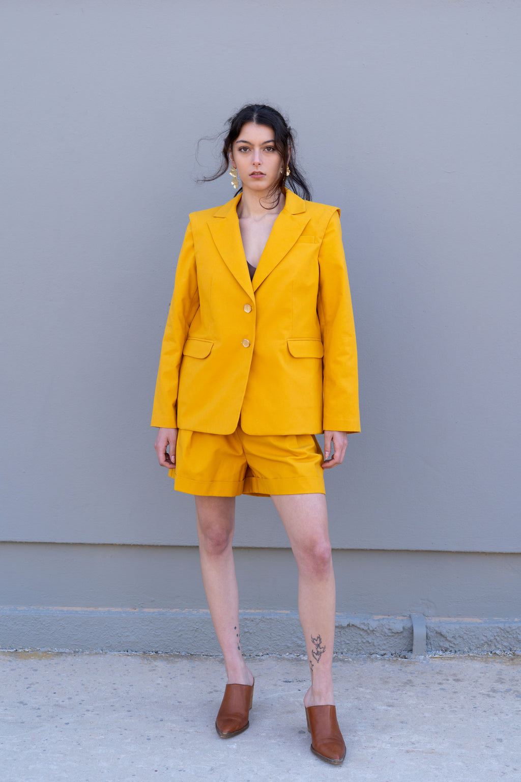 canary yellow tailored blazer with structured shoulders front view with matching bermuda shorts