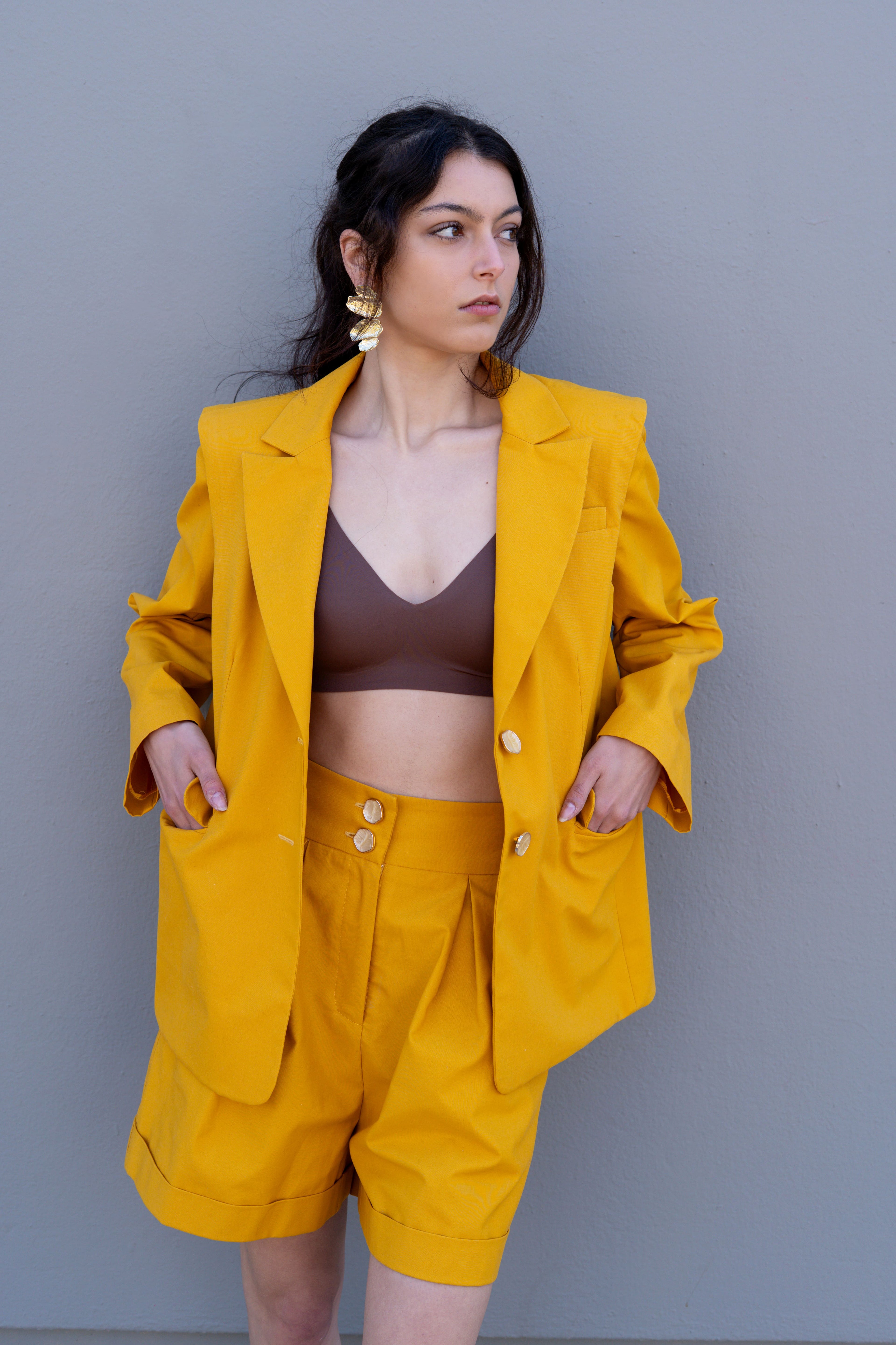canary yellow tailored blazer open front styling with matching bermuda shorts and bralette