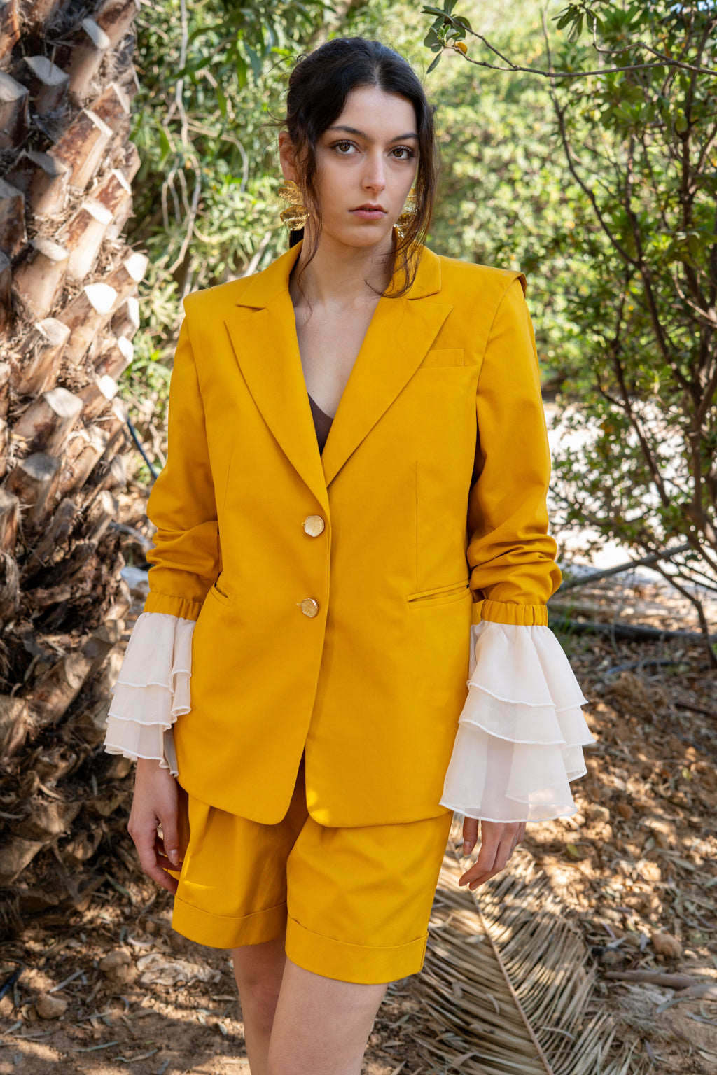 canary yellow tailored blazer with detachable sheer ruffle sleeves and matching bermuda shorts