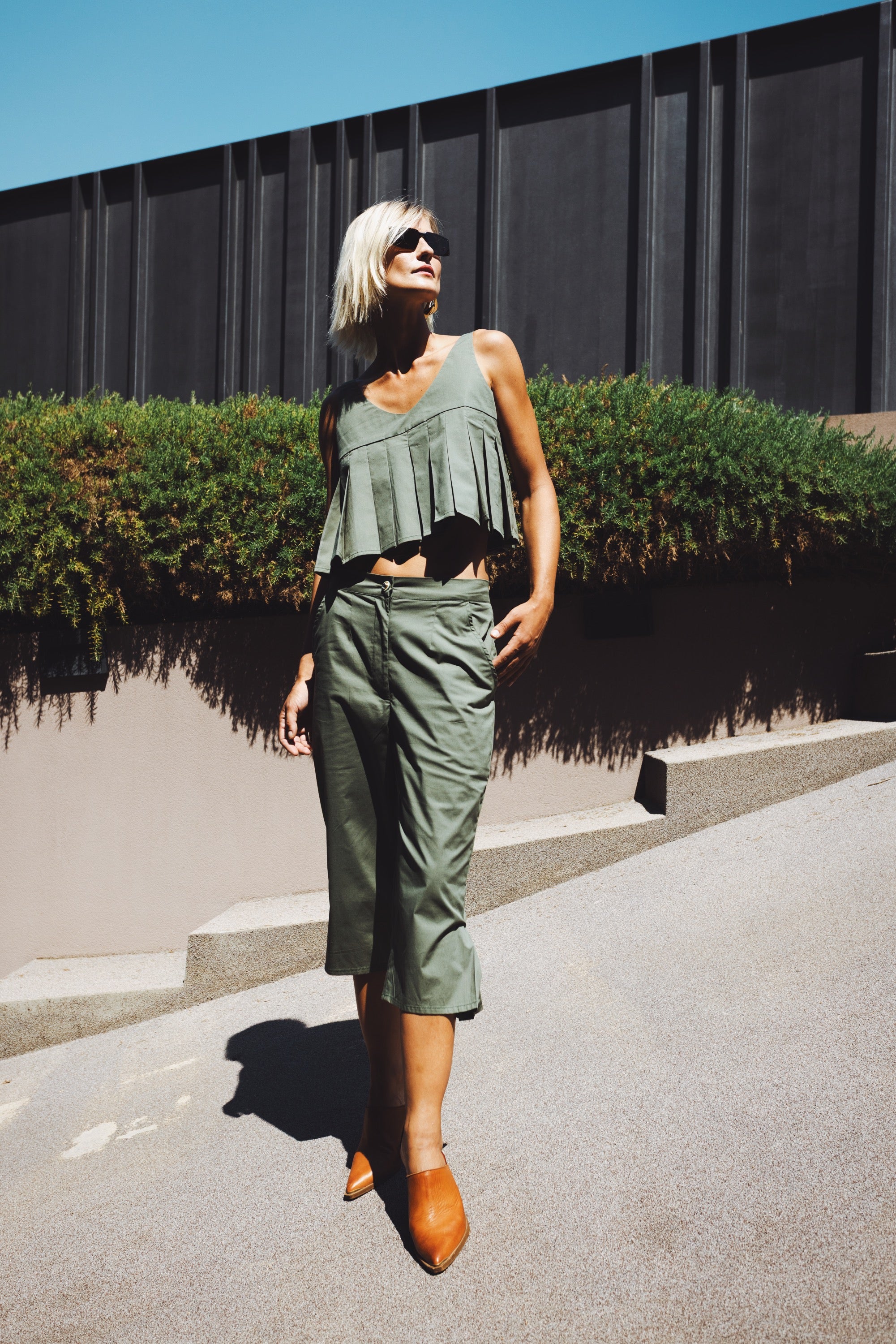 Julia Valas Elia Top with olive capri trousers matching set worn in sunlit summer look outdoors