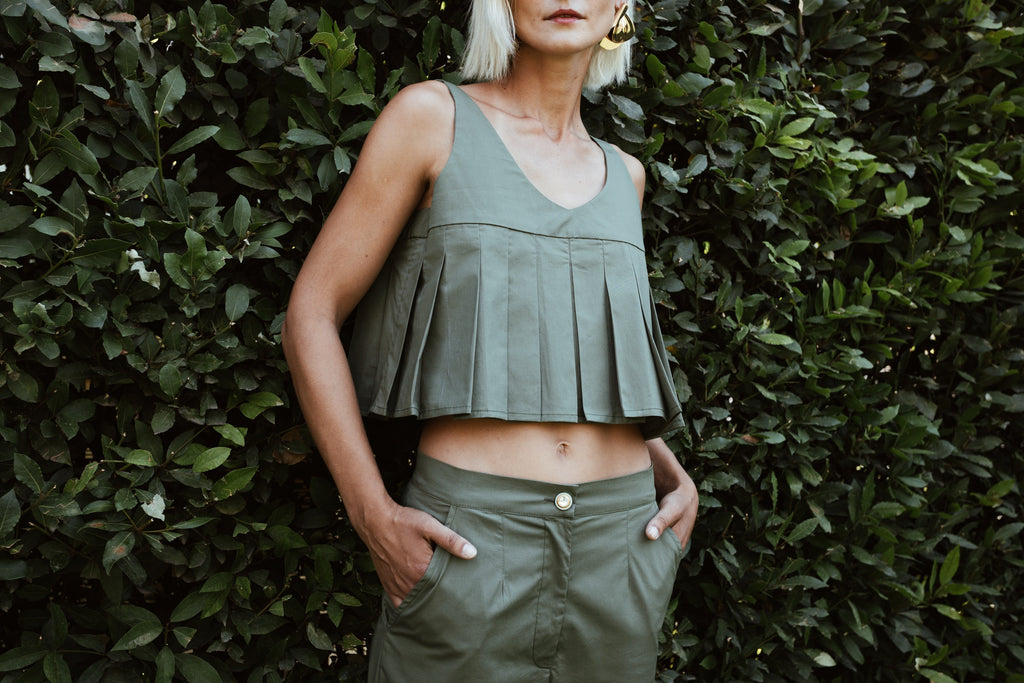 Julia Valas Elia Top olive pleated crop top with fluid silhouette worn with matching trousers under natural light
