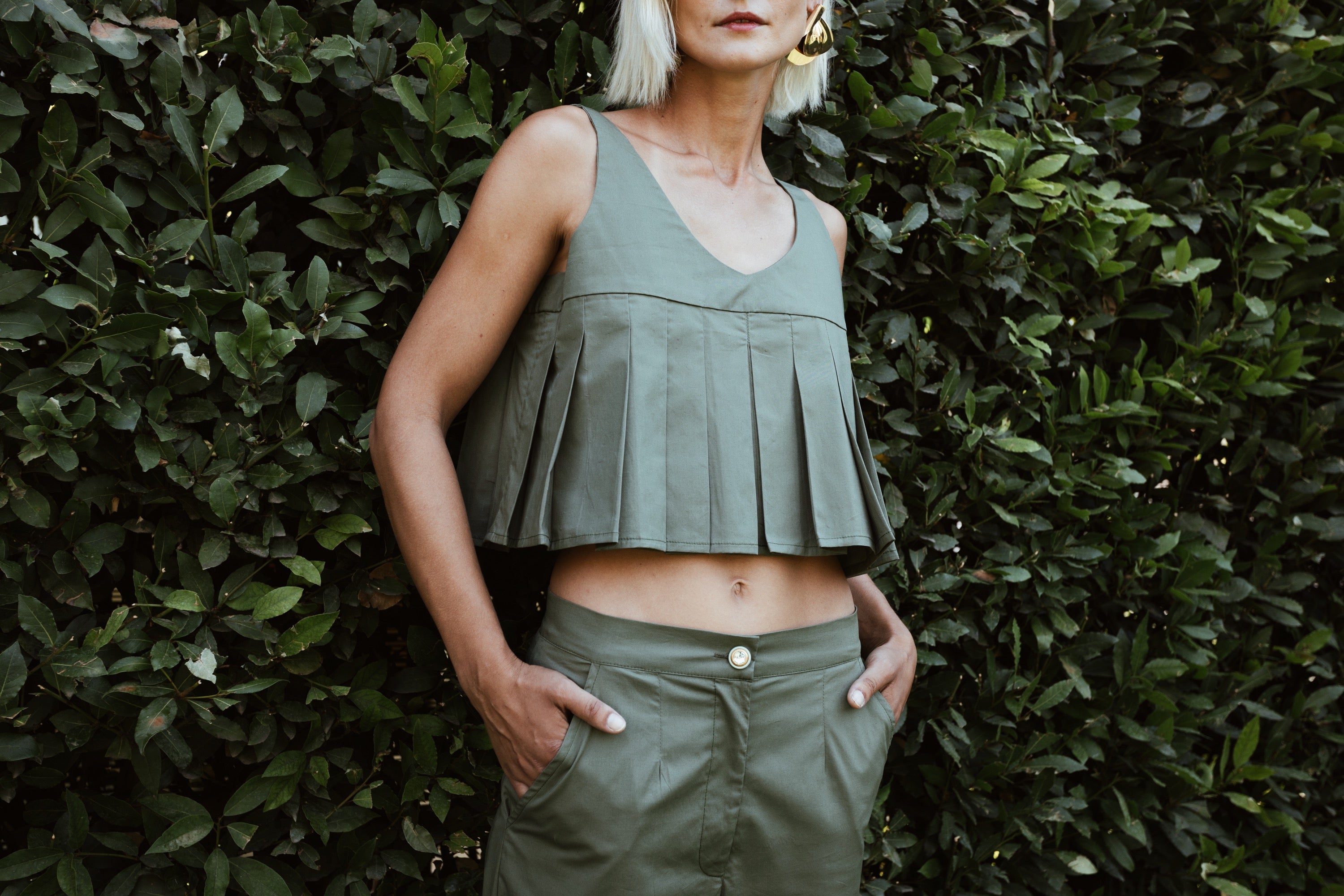 Julia Valas Elia Top olive pleated crop top with fluid silhouette worn with matching trousers under natural light