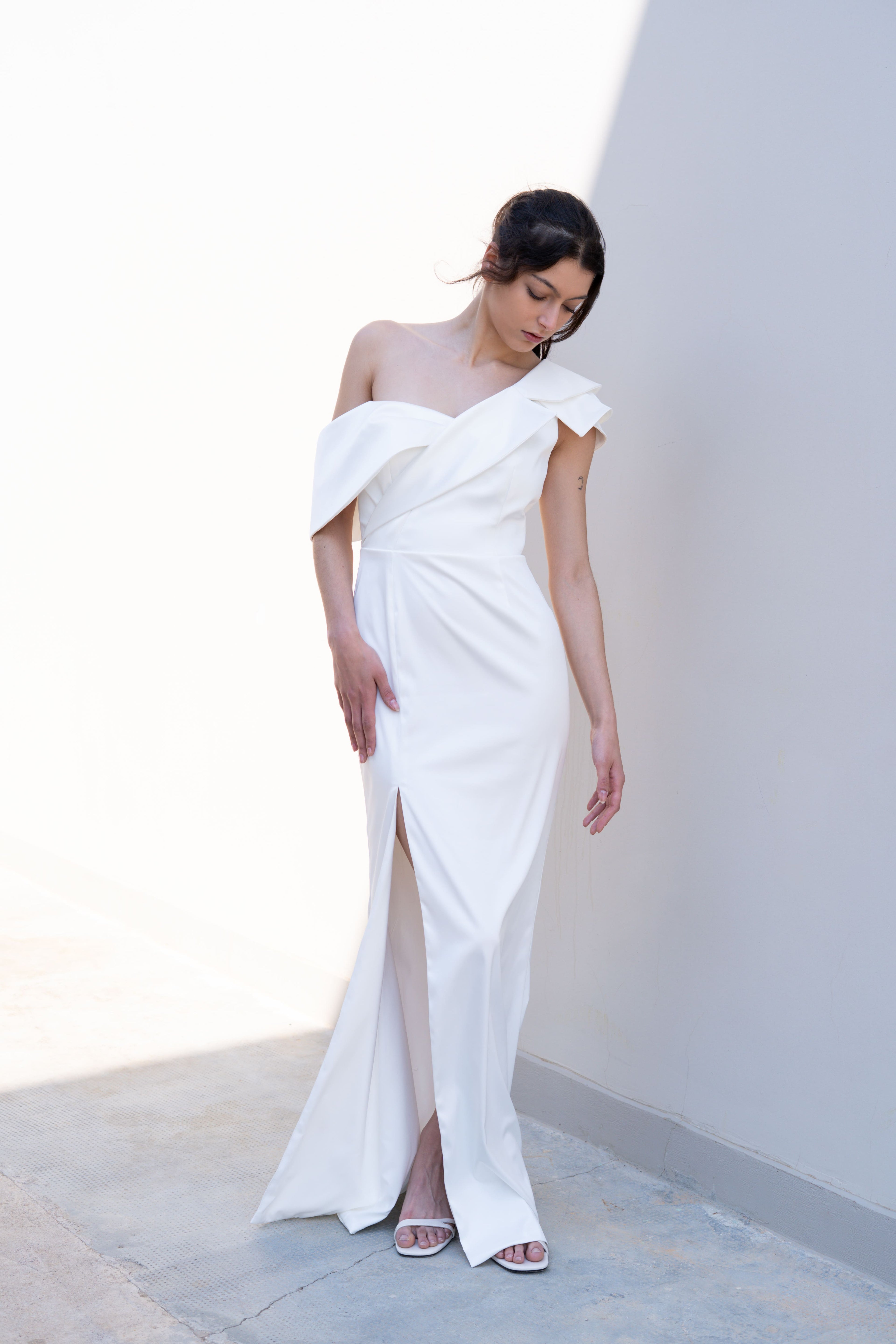 minimal one-shoulder bridal gown with deconstructed lapel neckline and front slit