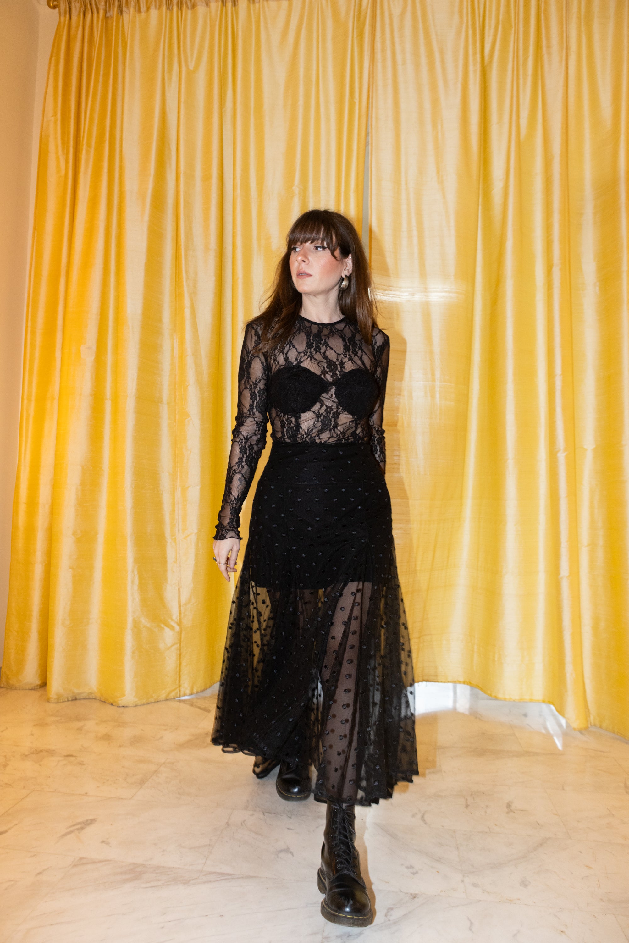 model walking in black polka dot tulle skirt with sheer lace top Julia Valas