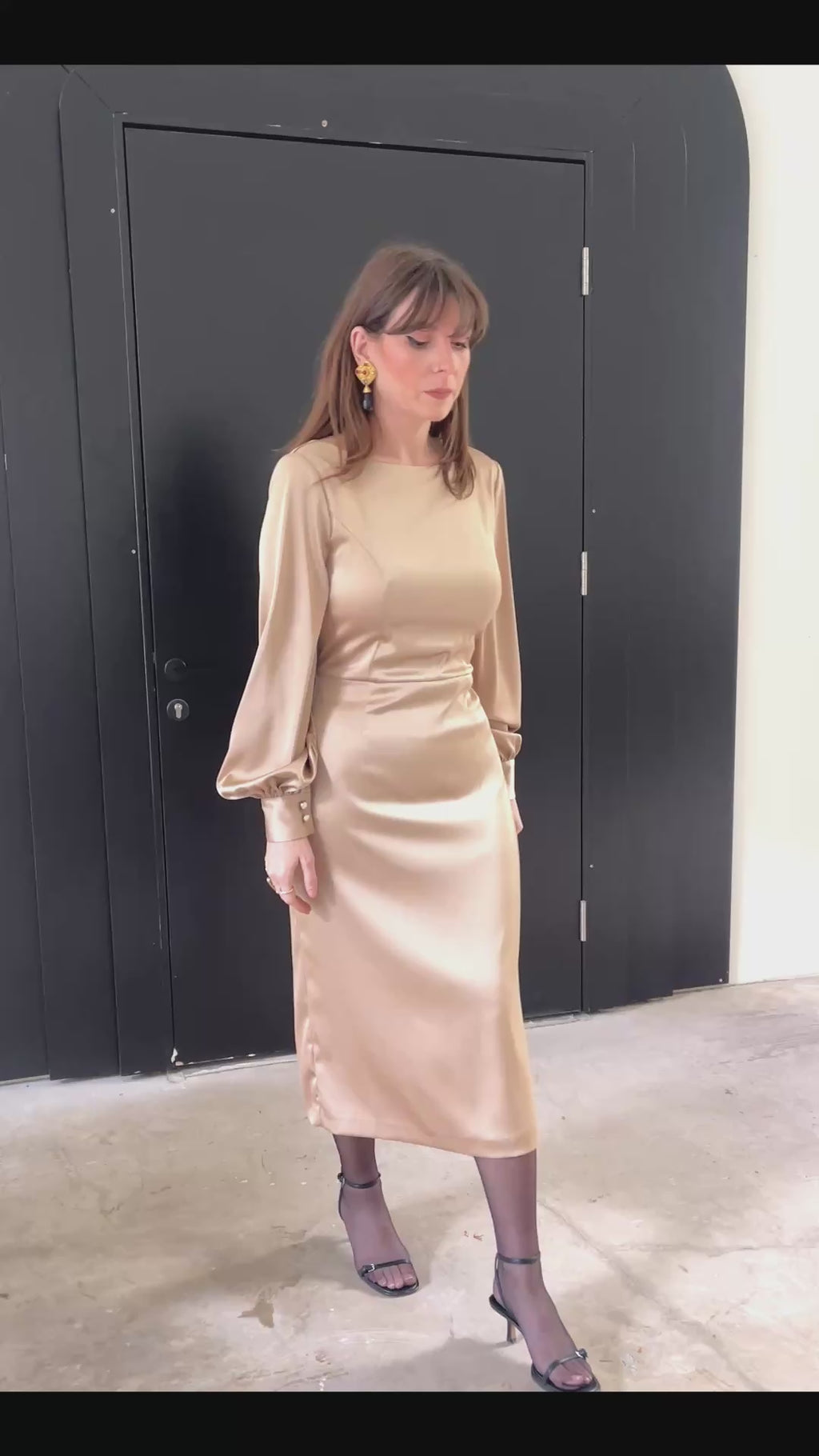 Open Flow midi dress in silk-blend fabric with long sleeves and fluid silhouette, video of model moving in indoor and outdoor settings with greenery, Julia Valas