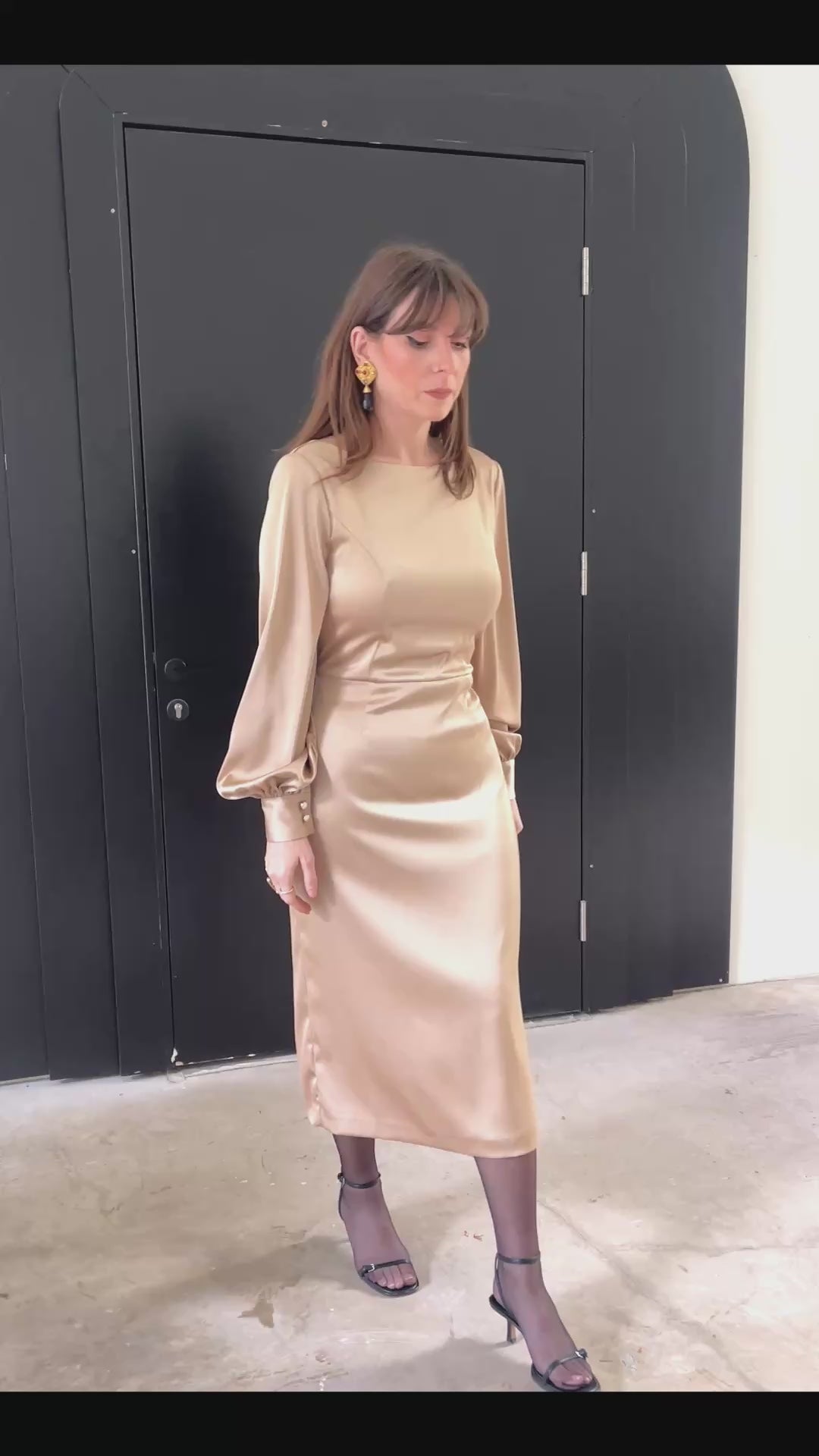 Open Flow midi dress in silk-blend fabric with long sleeves and fluid silhouette, video of model moving in indoor and outdoor settings with greenery, Julia Valas