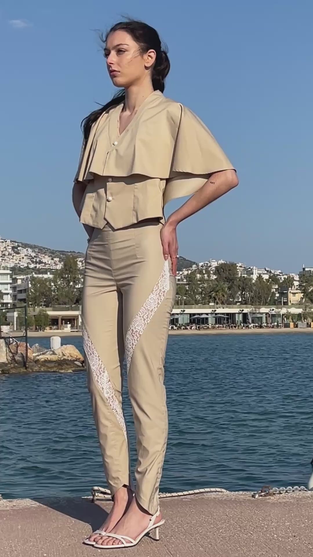 Julia Valas bamboo vest and detachable cape with lace detail asymmetric pants set front view by the sea neutral summer outfit video