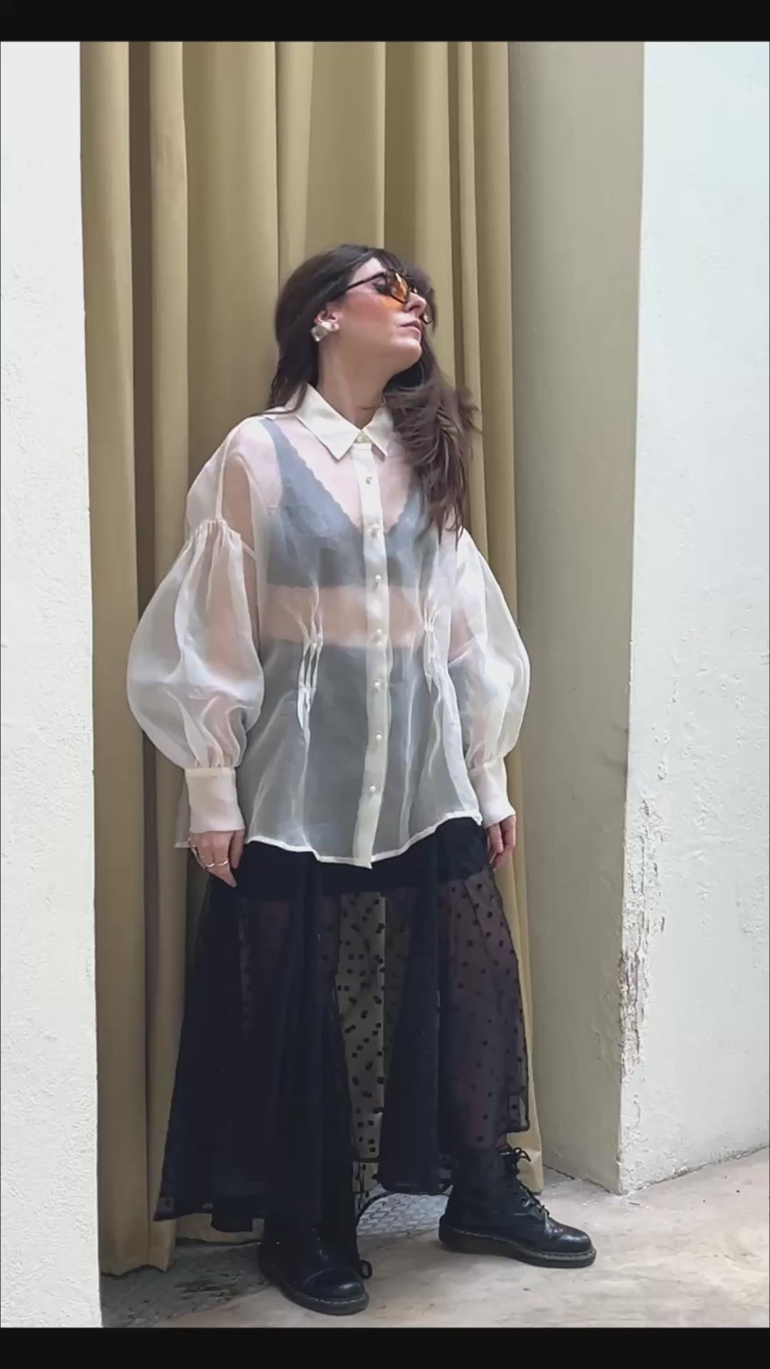 black embroidered tulle skirt in motion styled with sheer organza shirt model walking and sitting Julia Valas