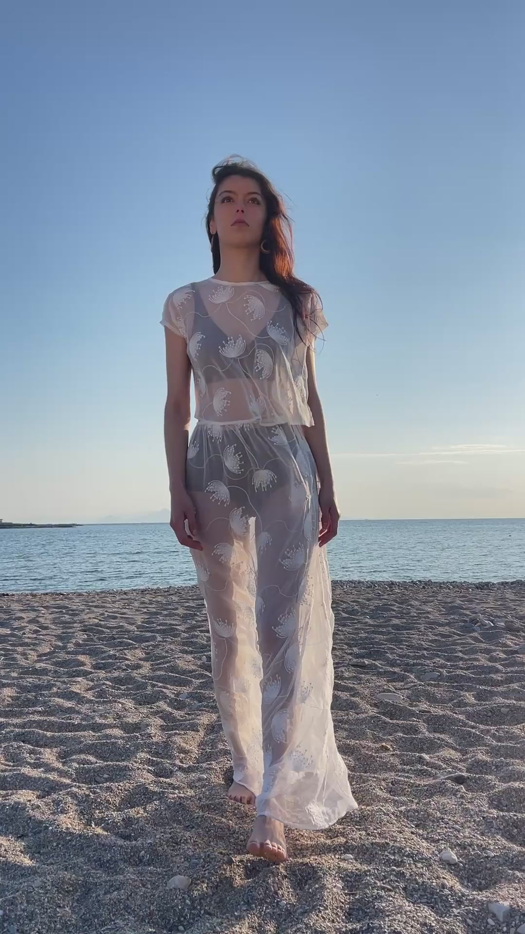 Thalassa Sheer Set with embroidered sheer crop top and flowing transparent maxi skirt, ethereal coastal resort womenswear walking video in soft sunset light by Julia Valas