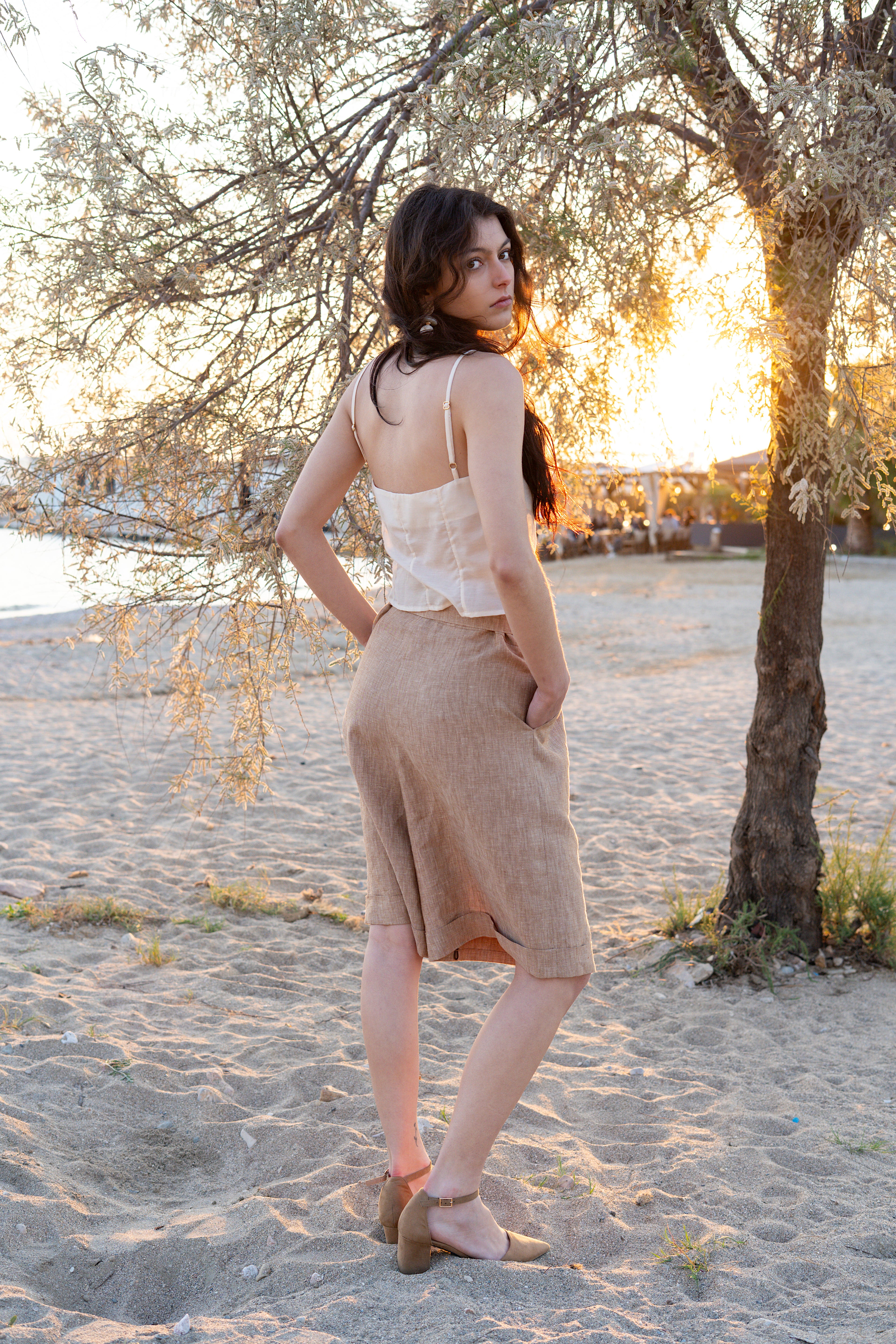 Sweetheart cotton silk bustier top and Smart Volume bermuda pants back view, thin strap structured crop top paired with high-waisted pleated bermuda, tailored summer silhouette in natural fabric