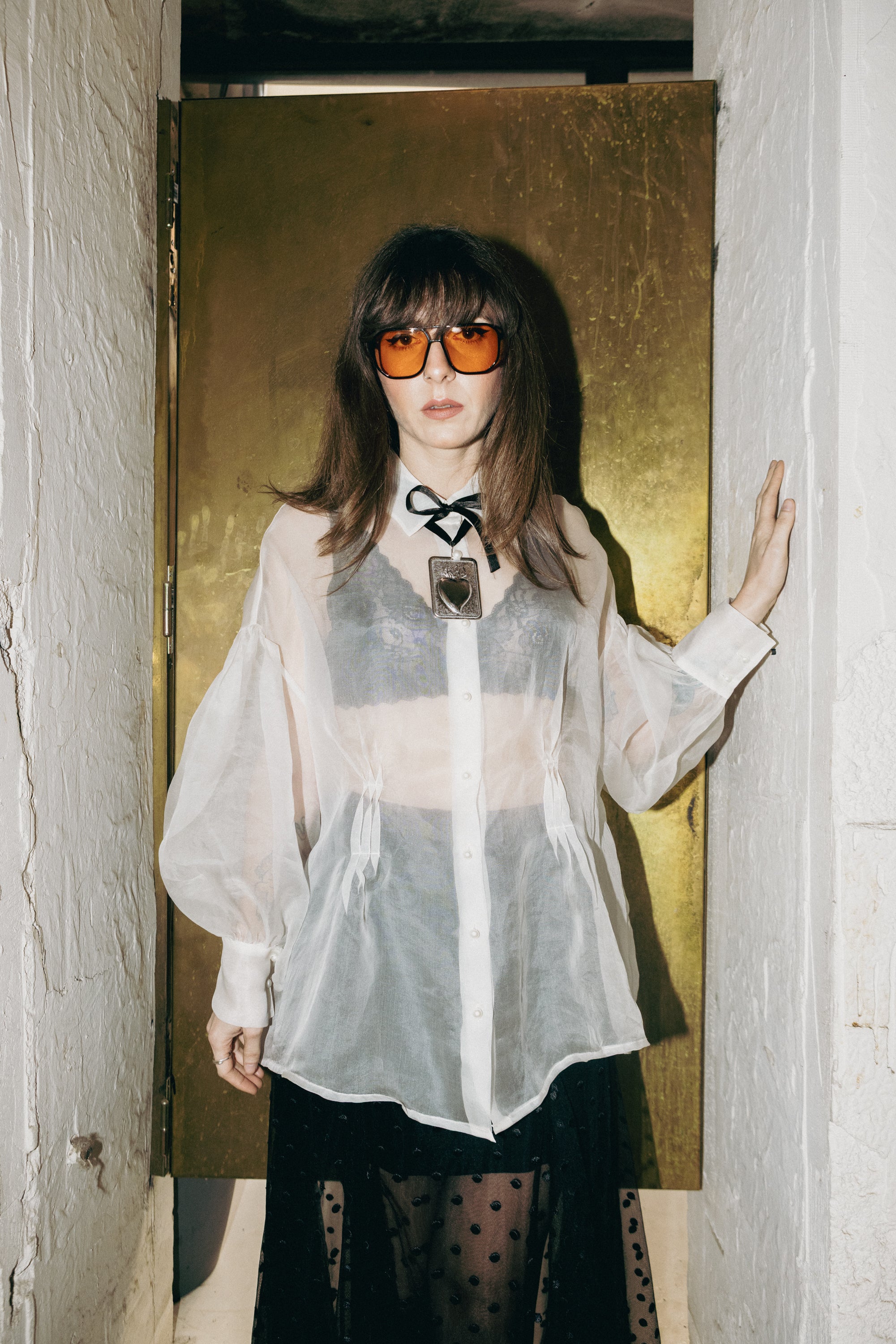 Sheer silk organza shirt with pearl buttons styled with black polka dot skirt, front view editorial look, Julia Valas
